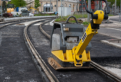 construction equipment compacting asphalt on railway tracks in urban area 10 construction tips for efficiency